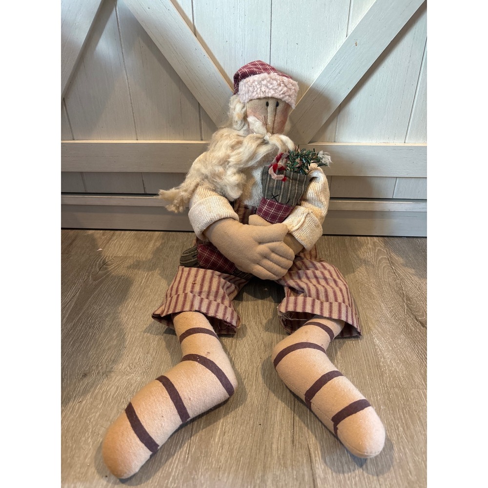 Old fashioned stuffed Santa holding stocking with candy canes Honey & Me